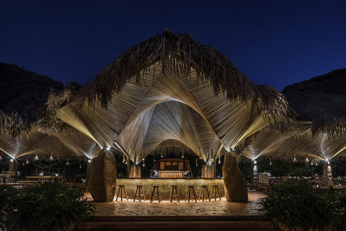 DDconcept Architecture uses coconut leaves and bamboo to create undulating restaurant in Vietnam