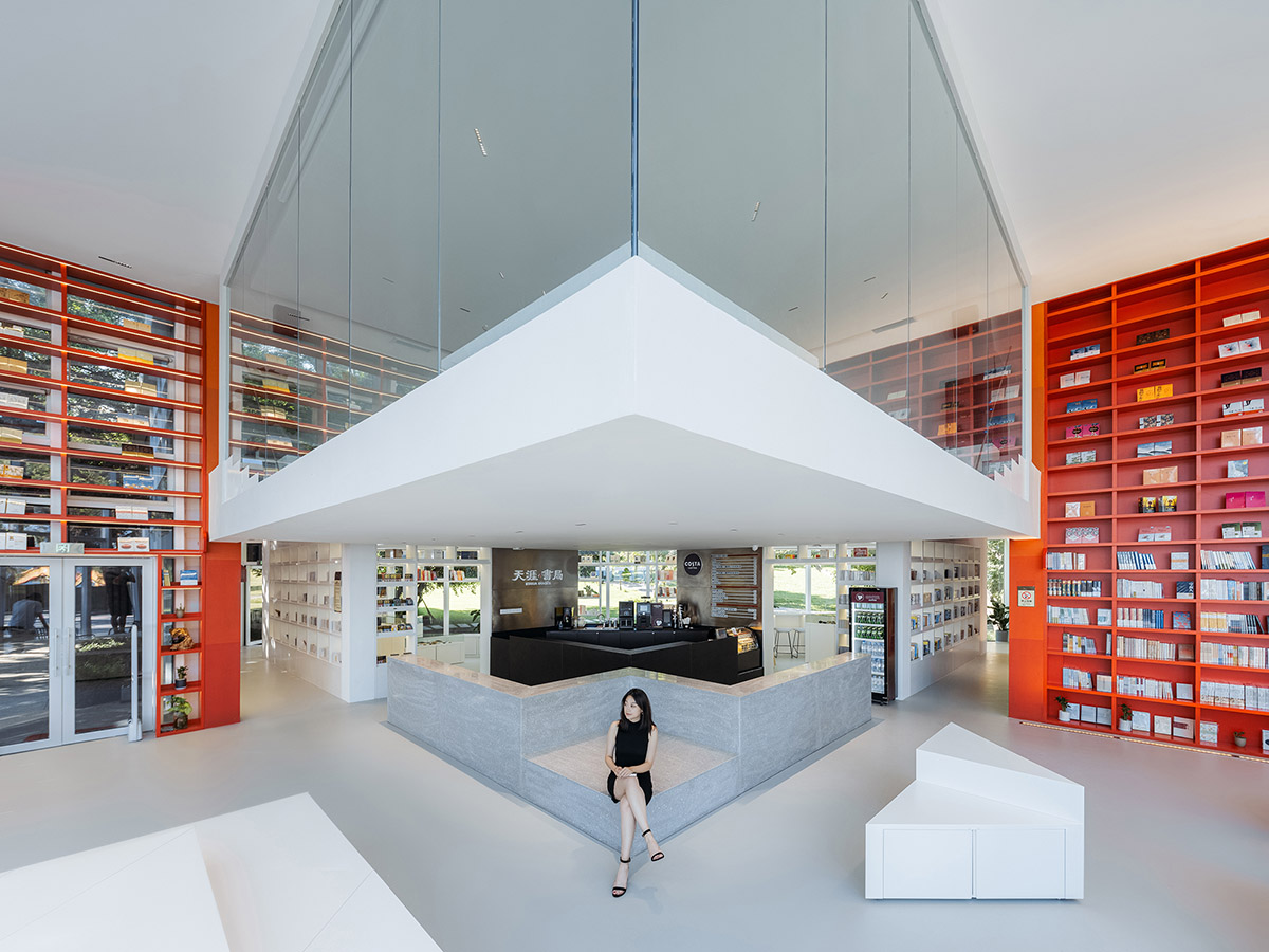 Wutopia Lab elaborates bookstore with red triangular bookshelves for Tianya Books in China 