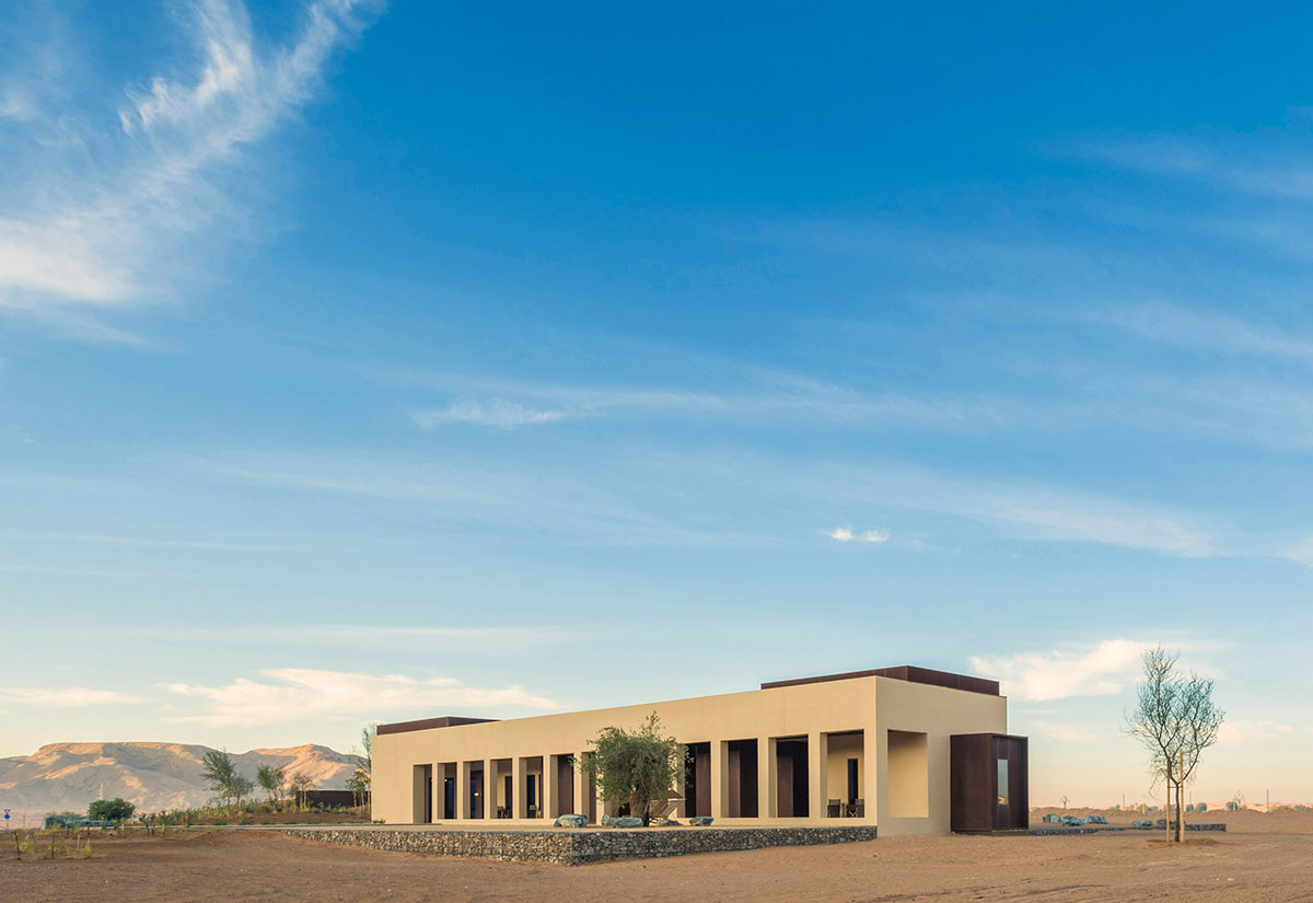 Anarchitect nestles this earth color hotel and spa building into the prehistoric of UAE