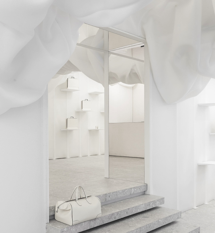 Snarkitecture created pop-up clouded-fabric for Valextra’s store in Milan