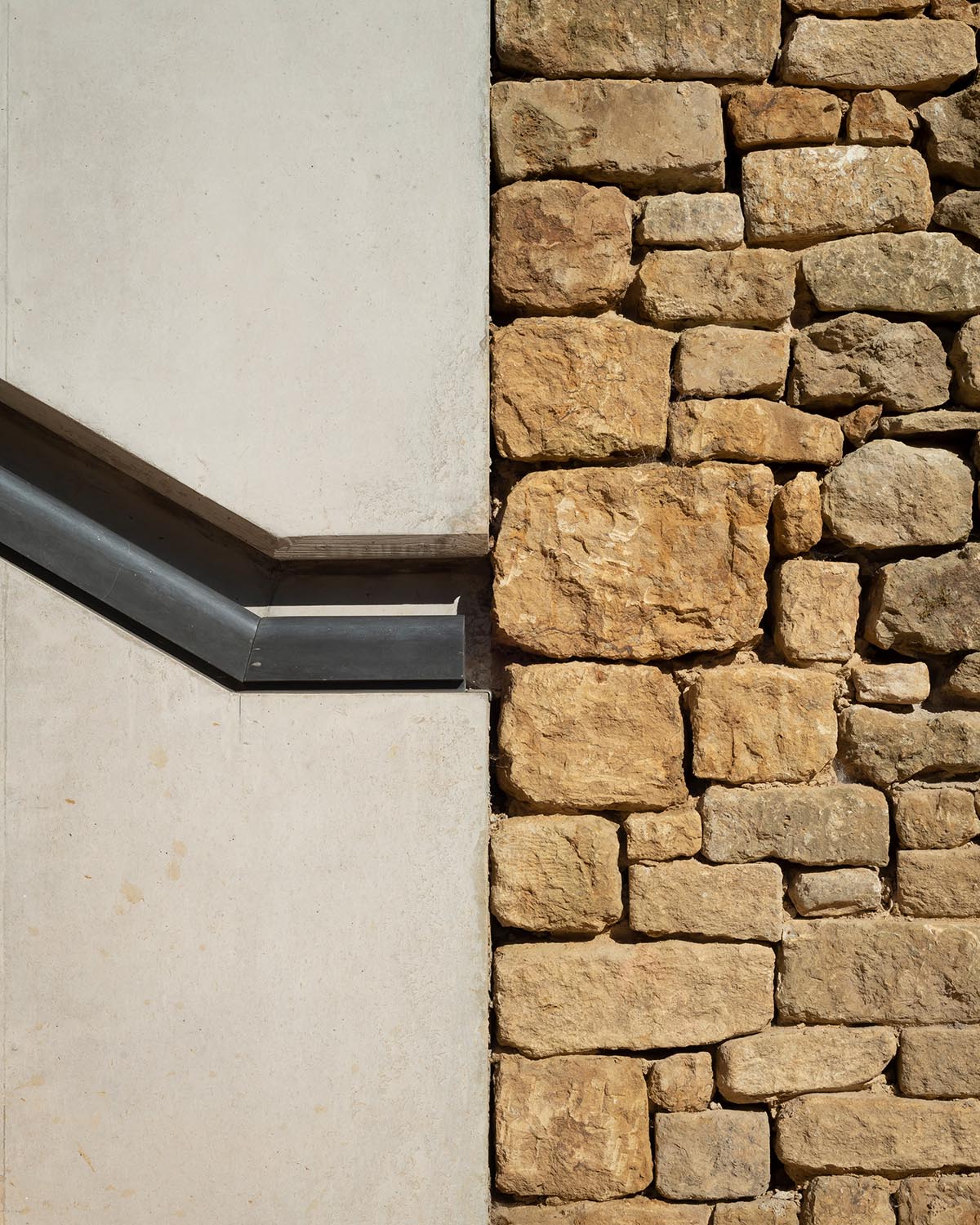 Invisible Studio creates large window for a gymnasium overlooking to a productive garden in Somerset