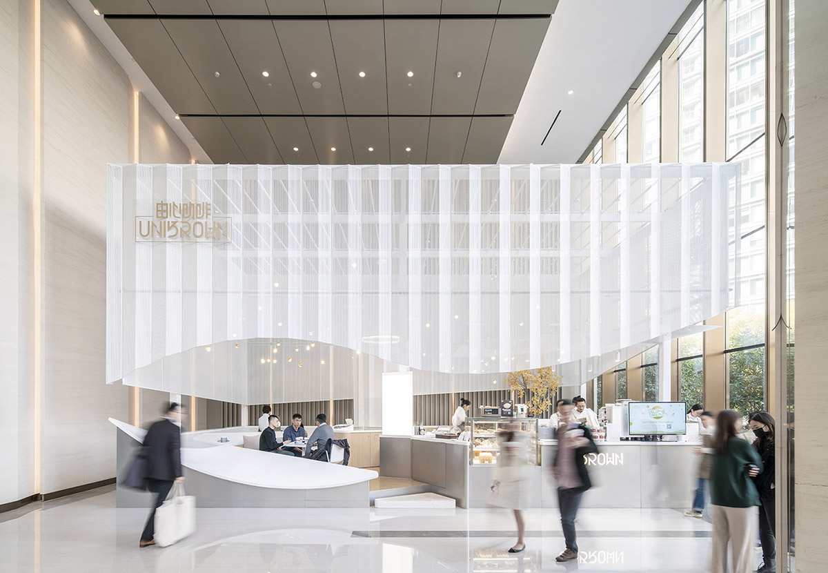 Mur Mur Lab uses all-white folded panels to create nature terrain for a coffee store in Shanghai