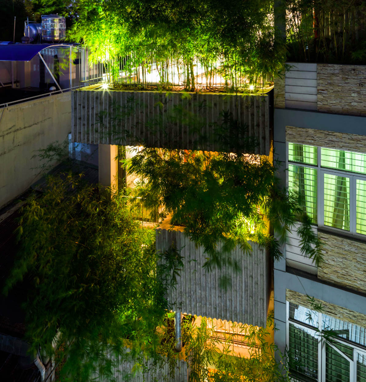 VTN Architects designs pop-up green facade for Bamboo House in a narrow site of Vietnam