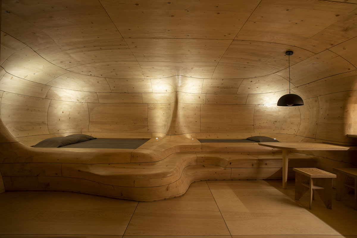 Tenon Architecture creates cave-like wooden interior for a resort in Greece