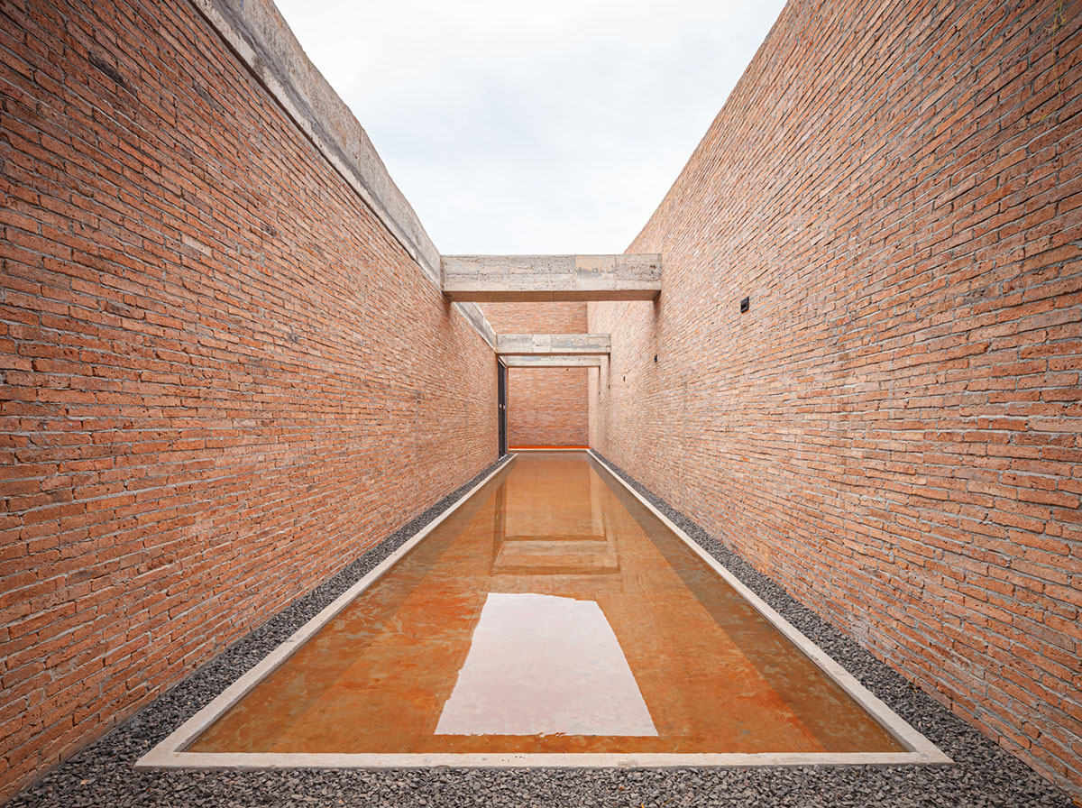 Bangkok Project Studio used over 480,0000 fired clay bricks to form elephant museum with curved walls
