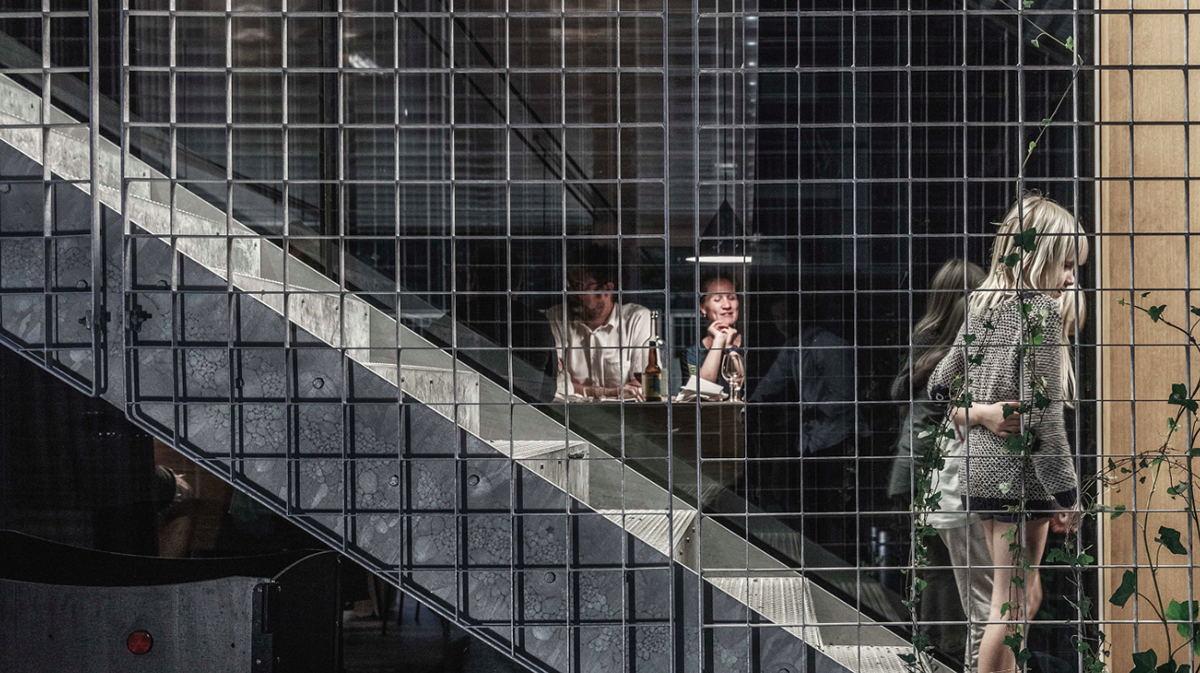A collage of elements reflecting surroundings assembled on the facade of Office Building by SLETH
