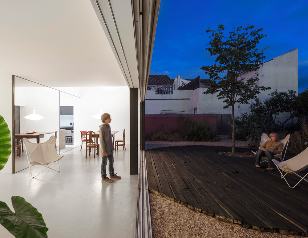 Extrastudio converted former winery in Portugal  into a new family home with red mortar walls