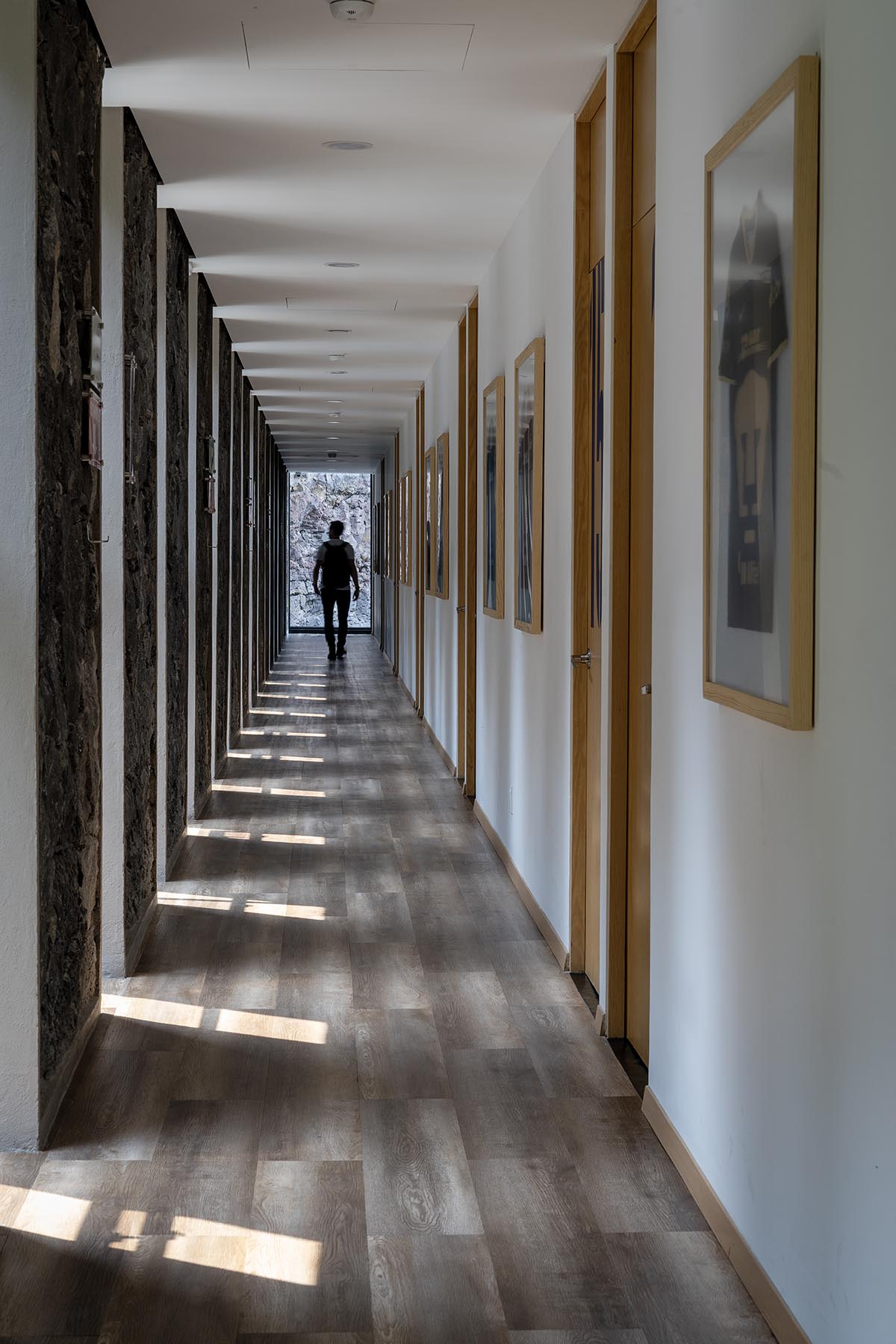 DF Arquitectos completes Pumas Clubhouse from volcanic stone in Mexico