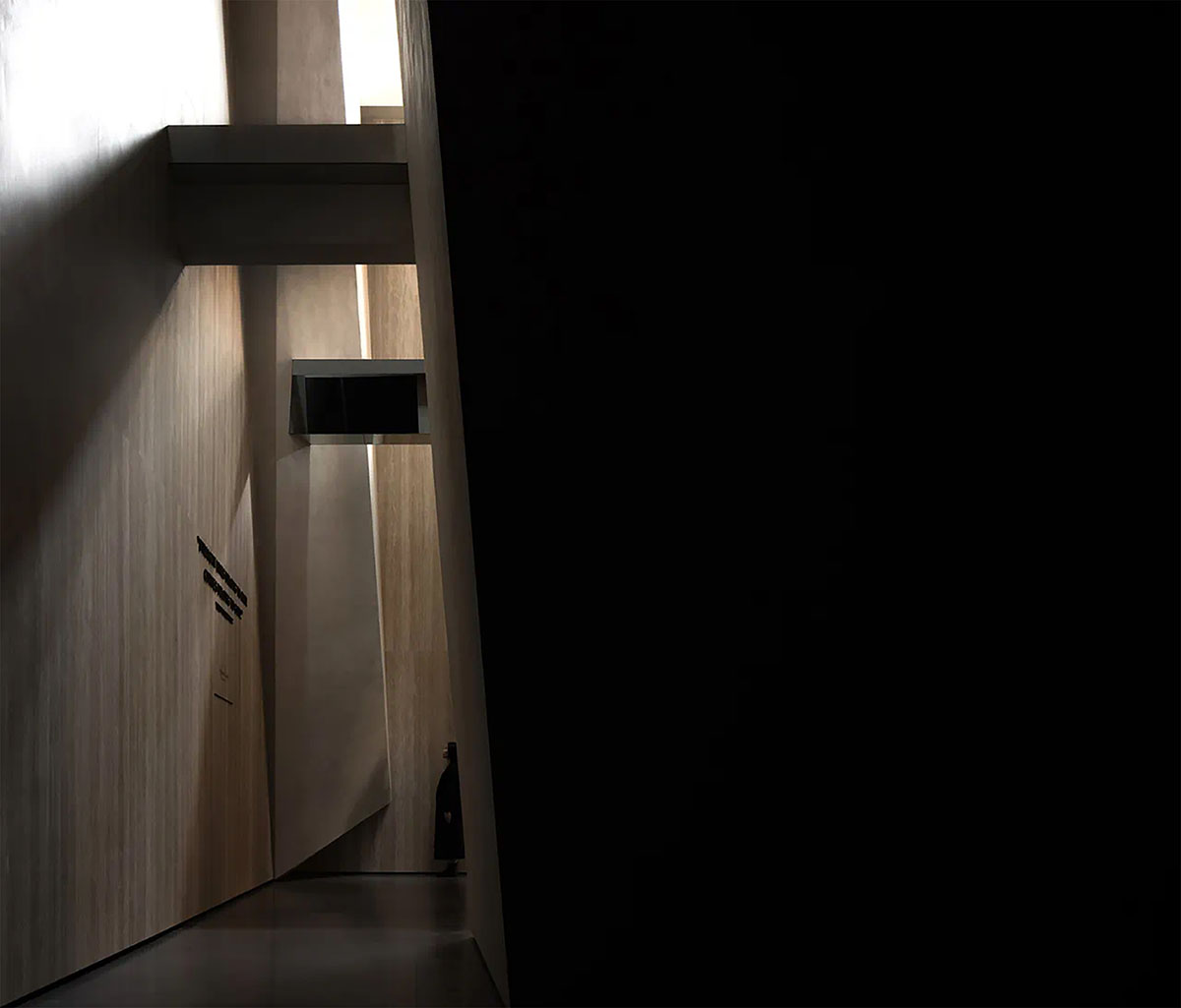 Exhibition hall interiors feature sharp angles and surfaces addressing diamond cutting processes