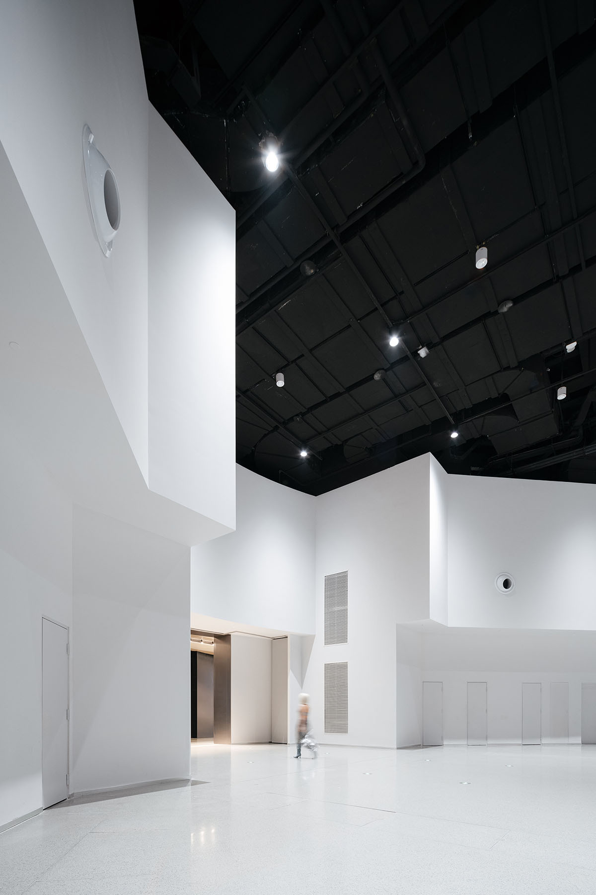 Undulating lines and expansive waves define interior of Orbit public exhibition hall in Shanghai 