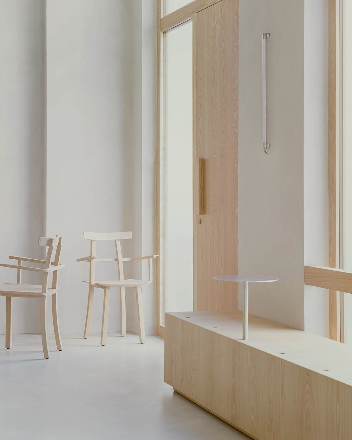 studio wok adds soft green tones and powder colors to interiors of a bakery in Milan 