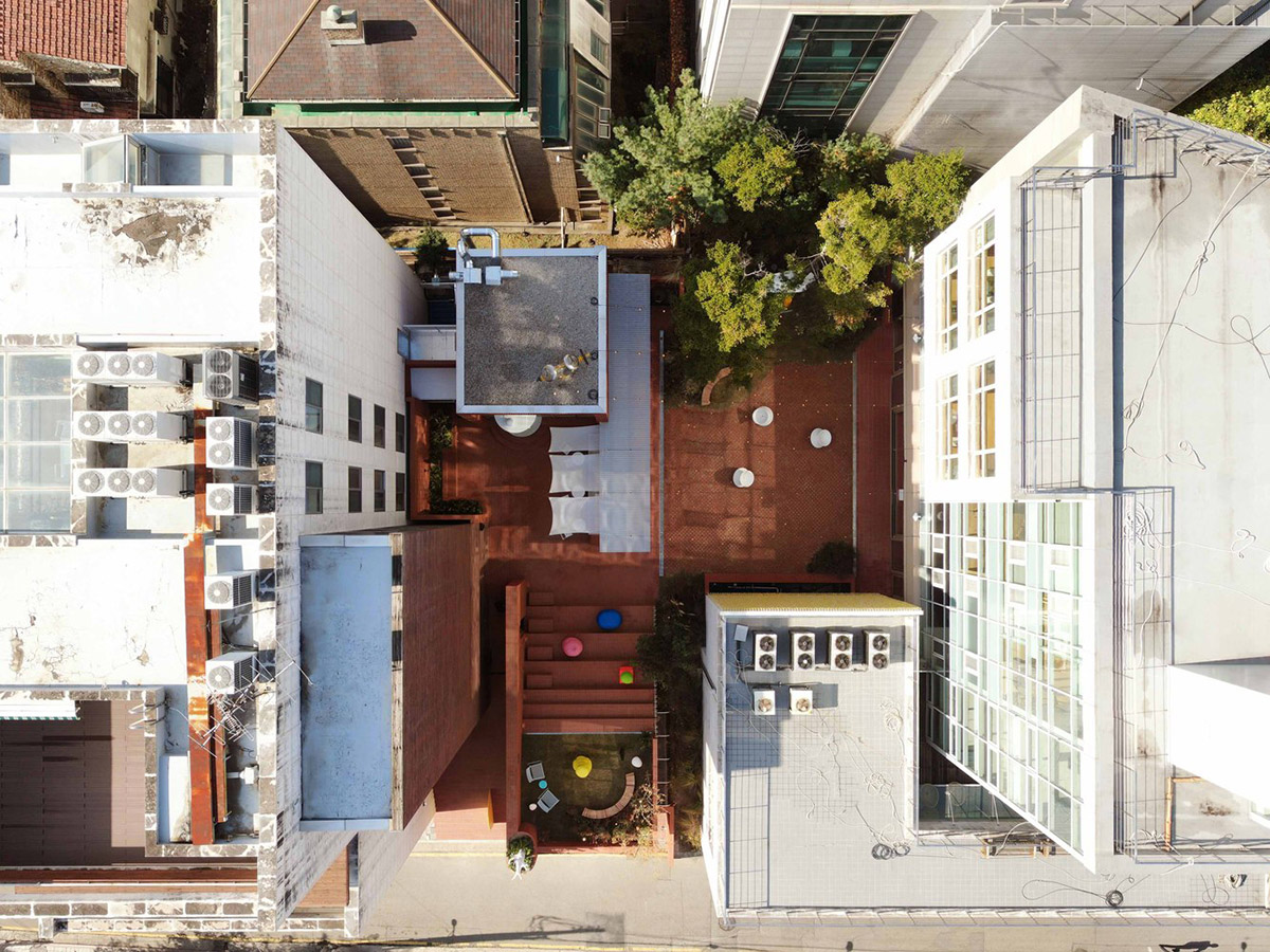 Roly-Poly Cotto restaurant fills in between historic buildings with its cave-like red brick facade