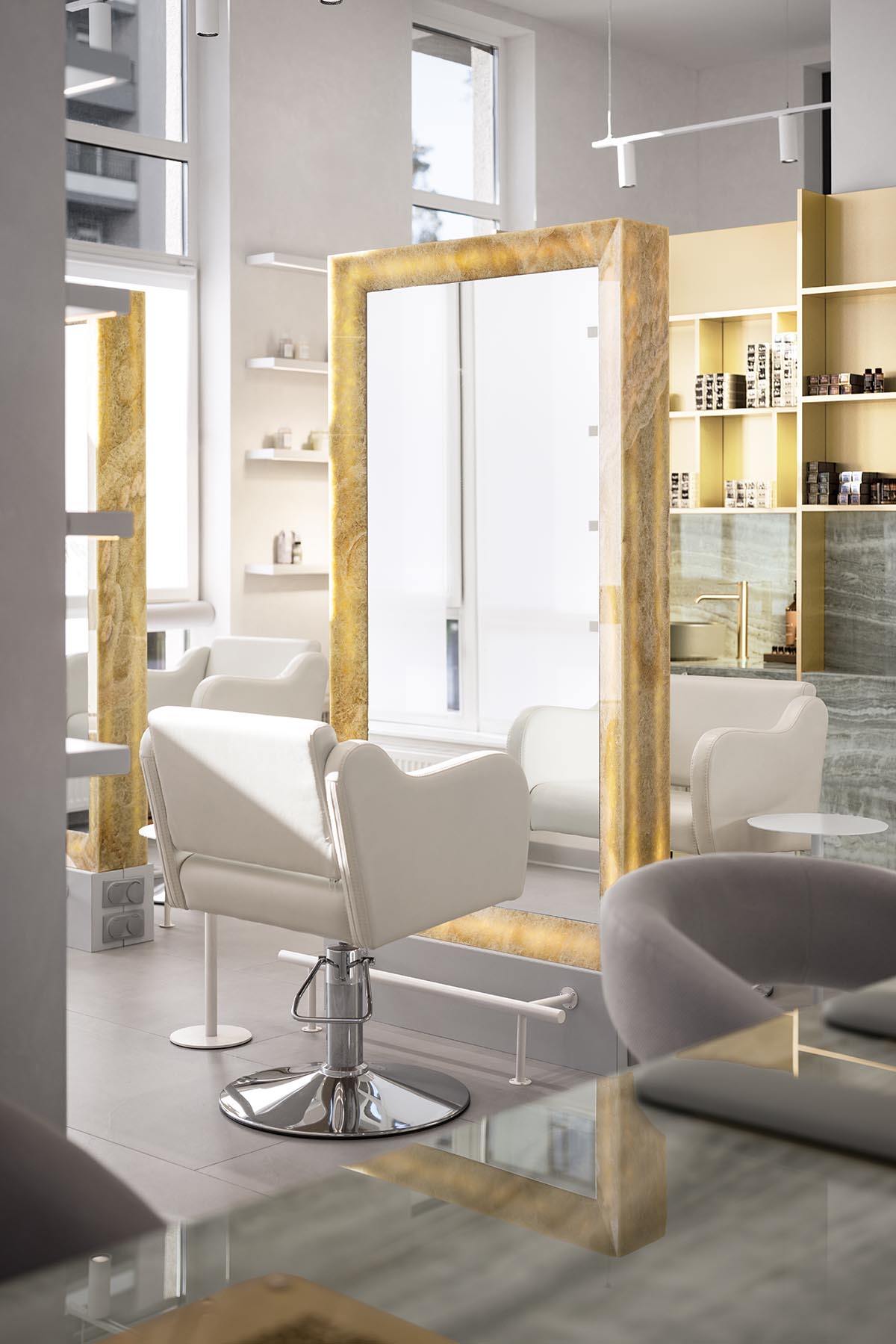 Mirrors and golden frames create a sense of care and deep comfort for beauty salon in Ukraine
