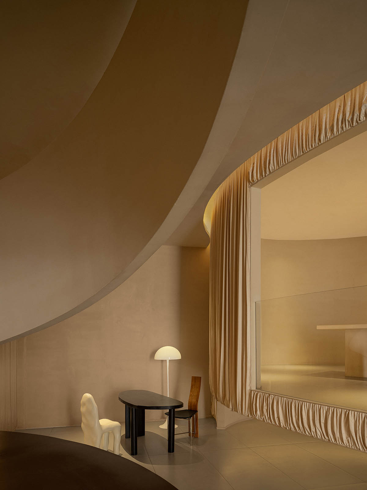 Tea house interiors wrapped by earth-toned fabric curtains act like ...