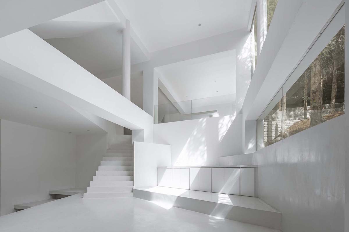 STUDIO QI reinterprets sequence of living conditions with tilted hotel on a hilly plot in China