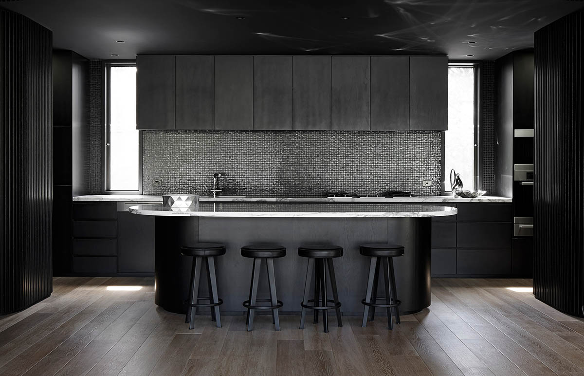 Wood Marsh built curvaceous home clad in dark timber contrasting its natural landscape in Portsea