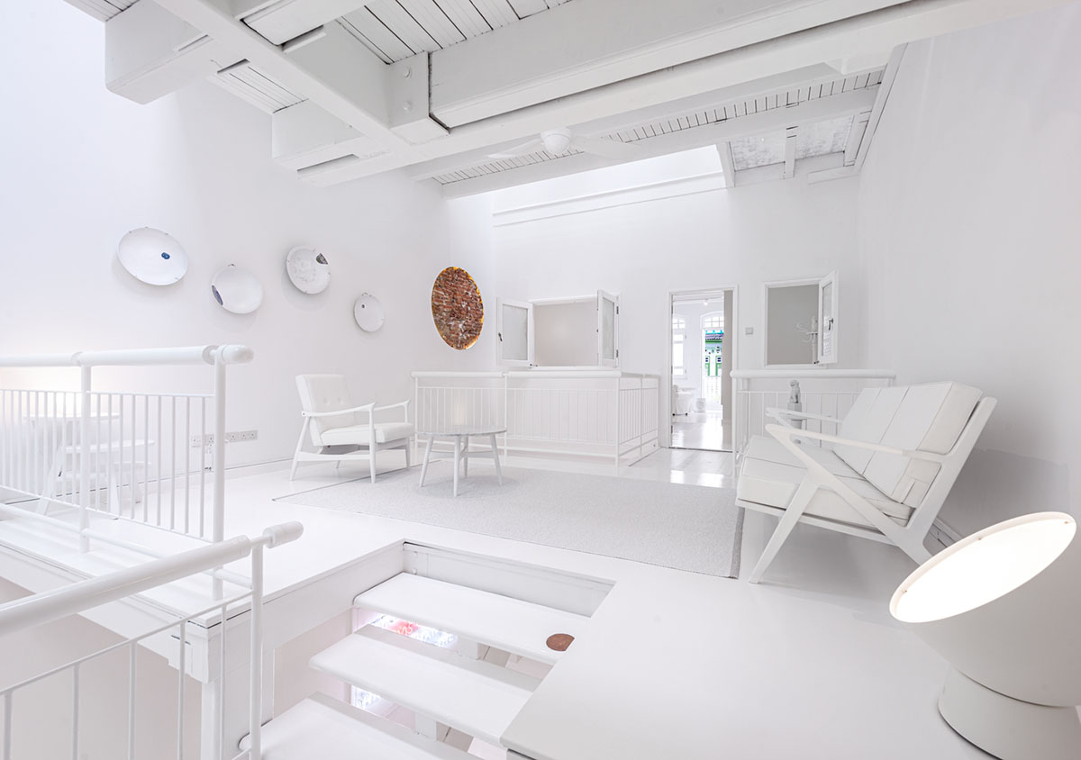 Ministry of Design transforms old dwelling in Singapore into co-living house with all-white interiors