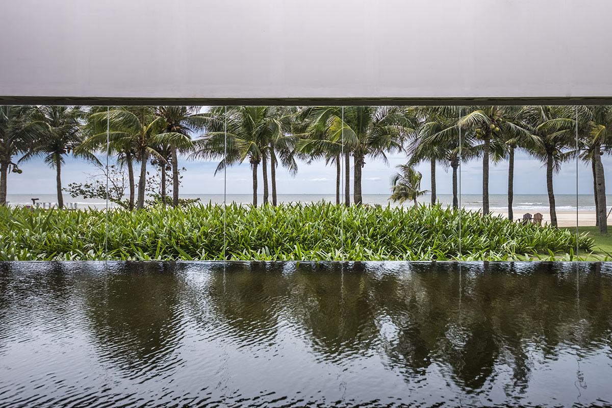 Six landscape boxes form this gallery and showroom by MIA Design Studio in Vietnam