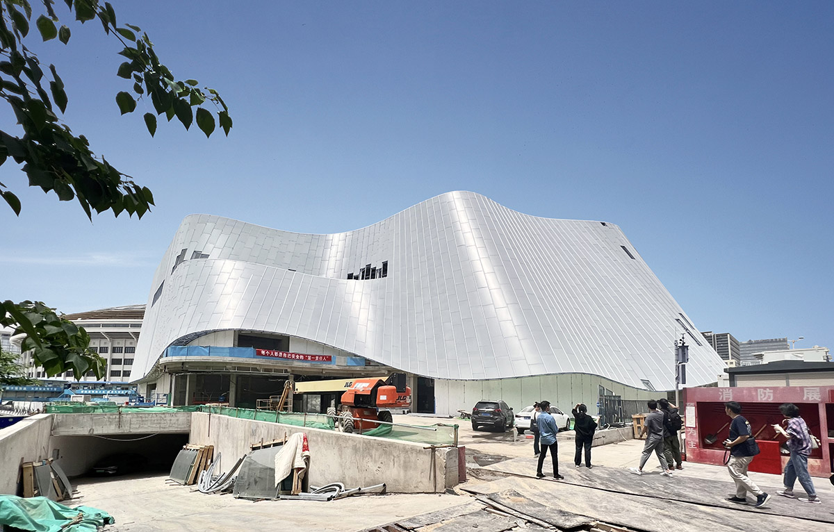 MAD's China Philharmonic Concert Hall, resembling an undulating ice jade, is nearing completion