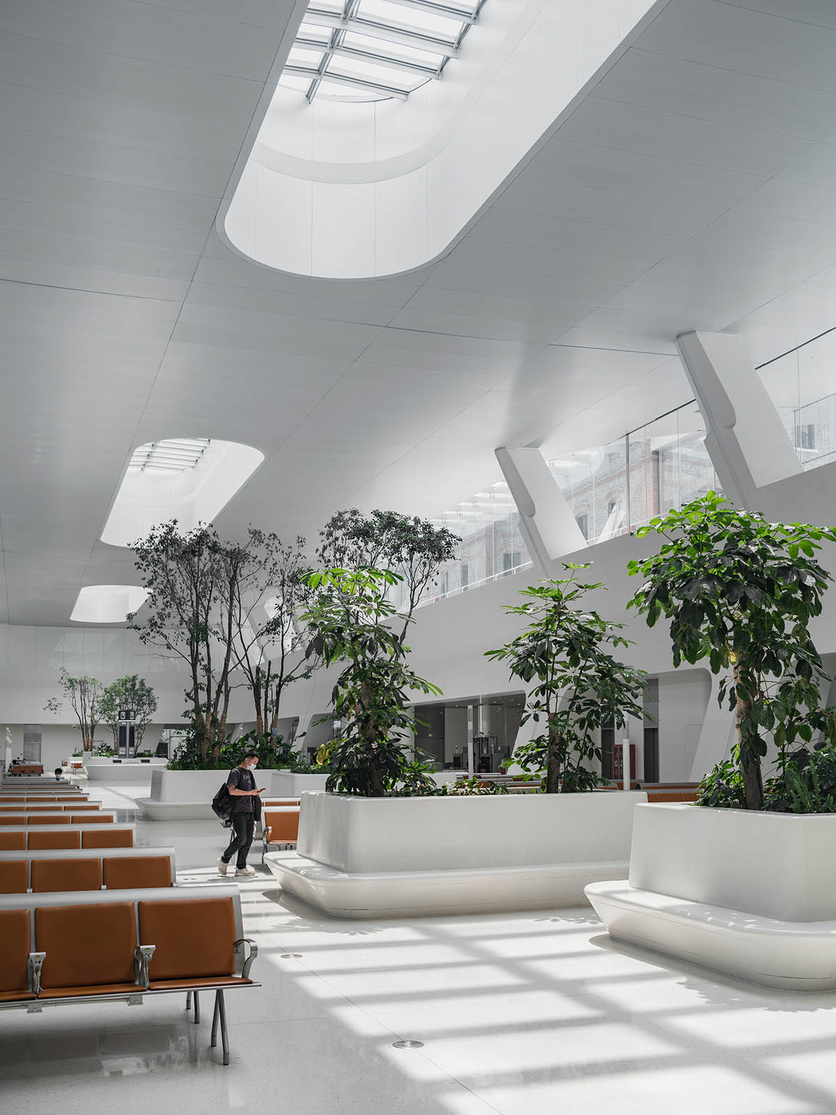 MAD completes Train Station In The Forest with a floating metal roof in Jiaxing