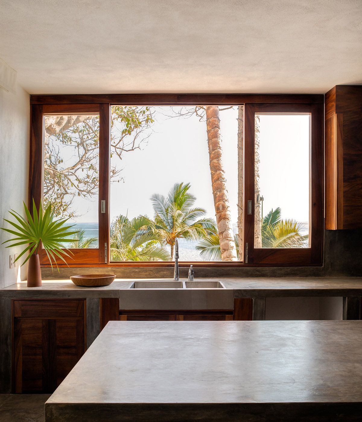 MAIN OFFICE's family house blends into the tropical landscape of a surfers' town in Mexico