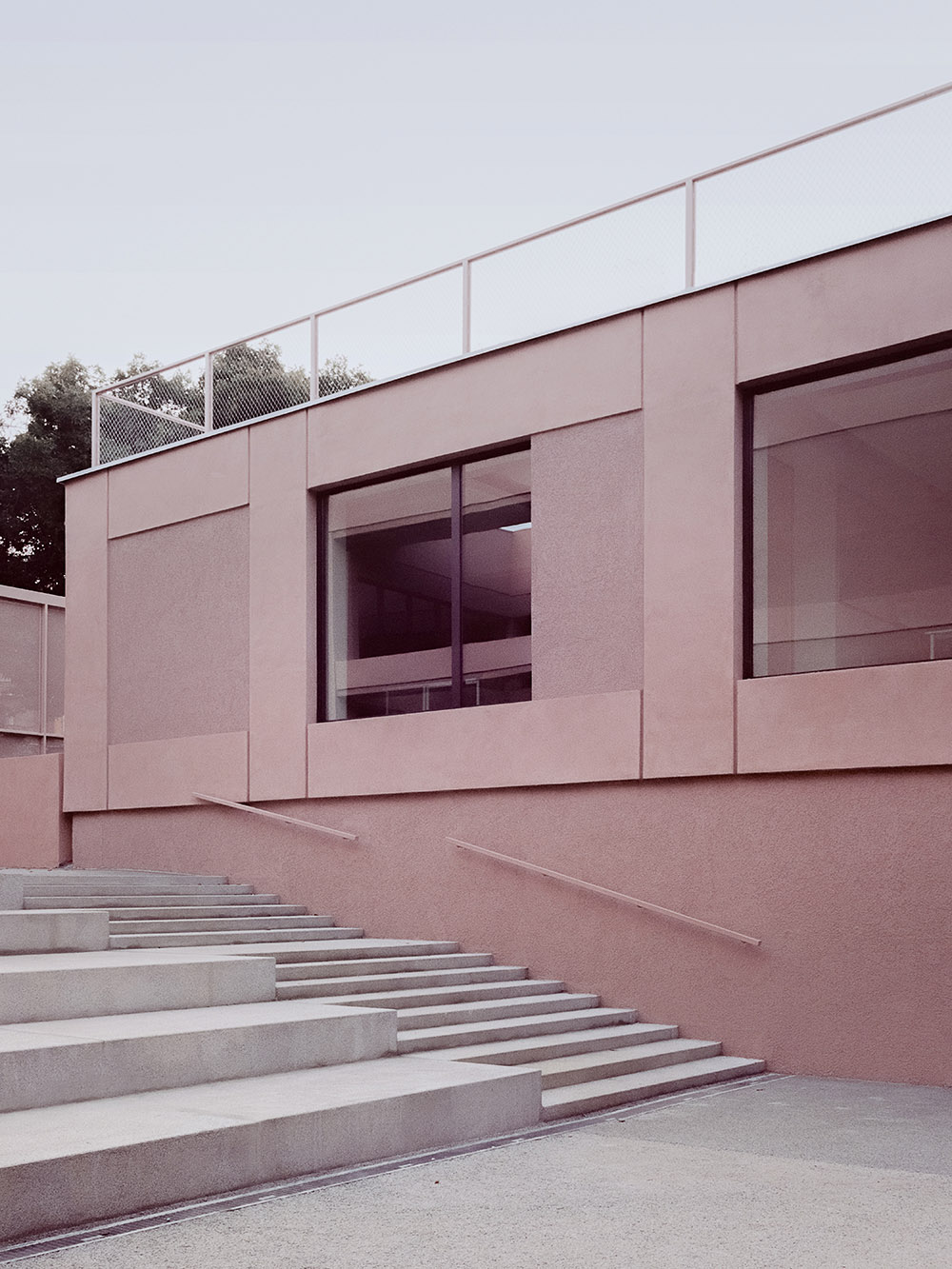 BDR bureau completes community school with pinkish steel framework in Turin