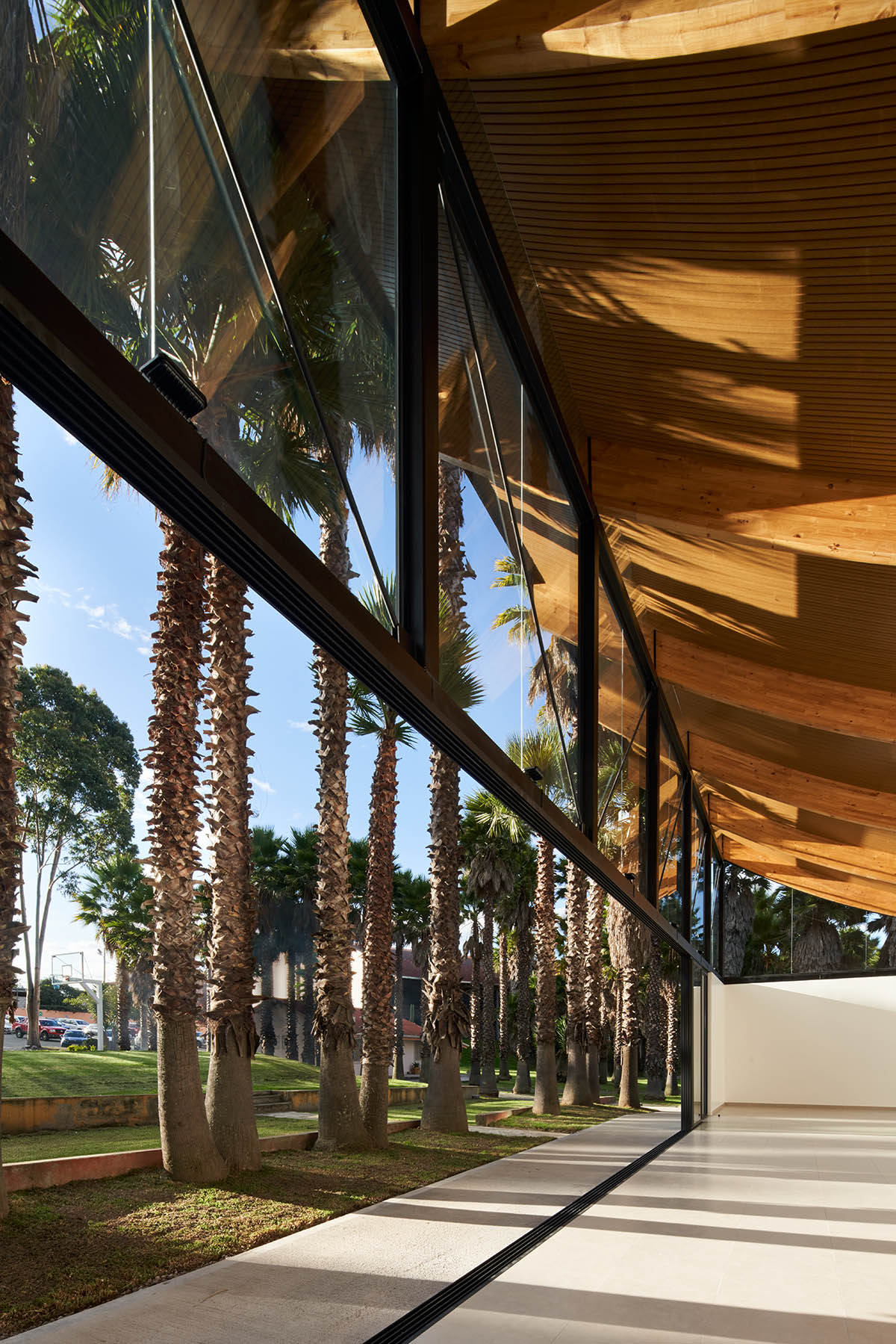 TEC Taller EC creates pavilion with concave wooden roof that becomes a façade in Ecuador