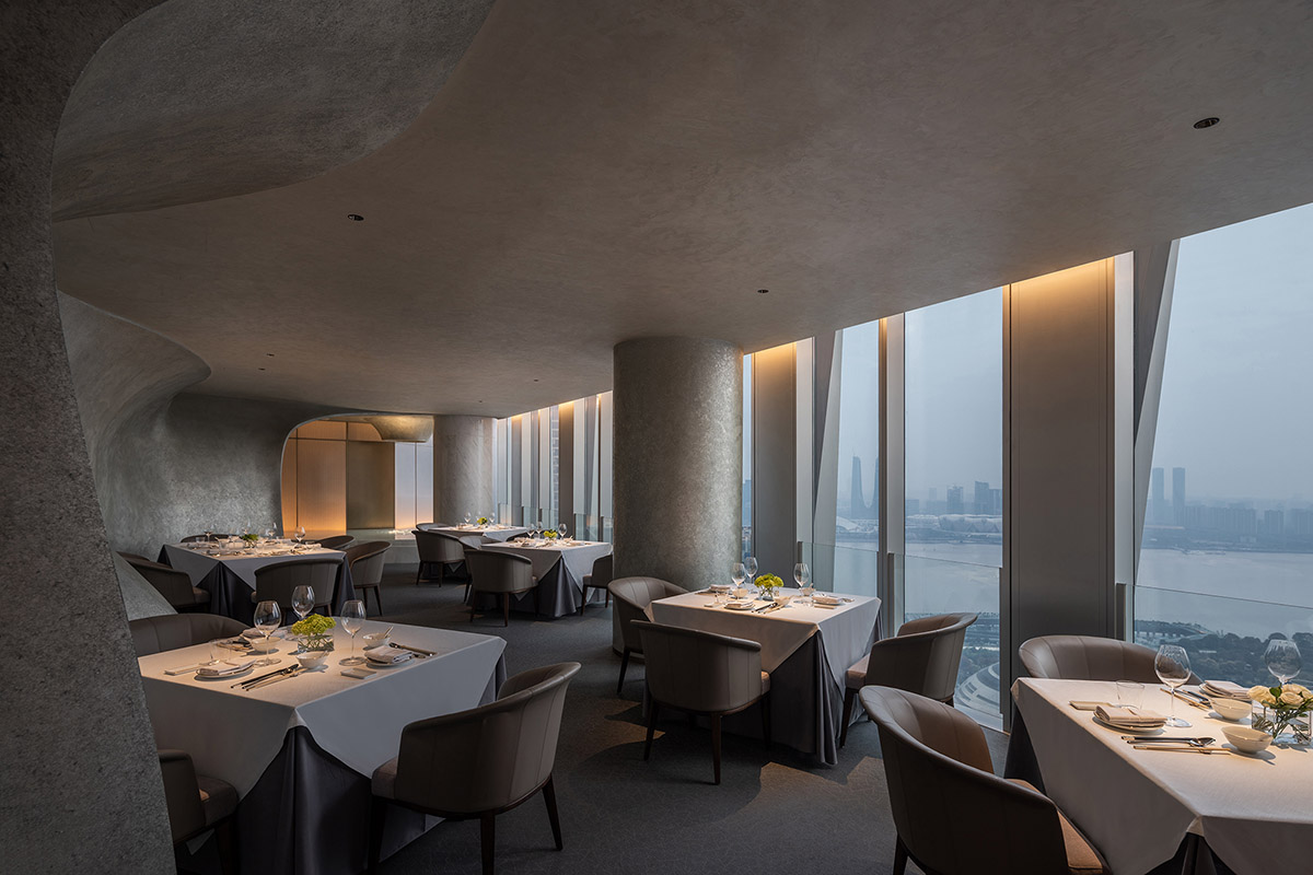 Nature Times Art Design completes restaurant with cave-like wall and garden-themed hall in Hangzhou