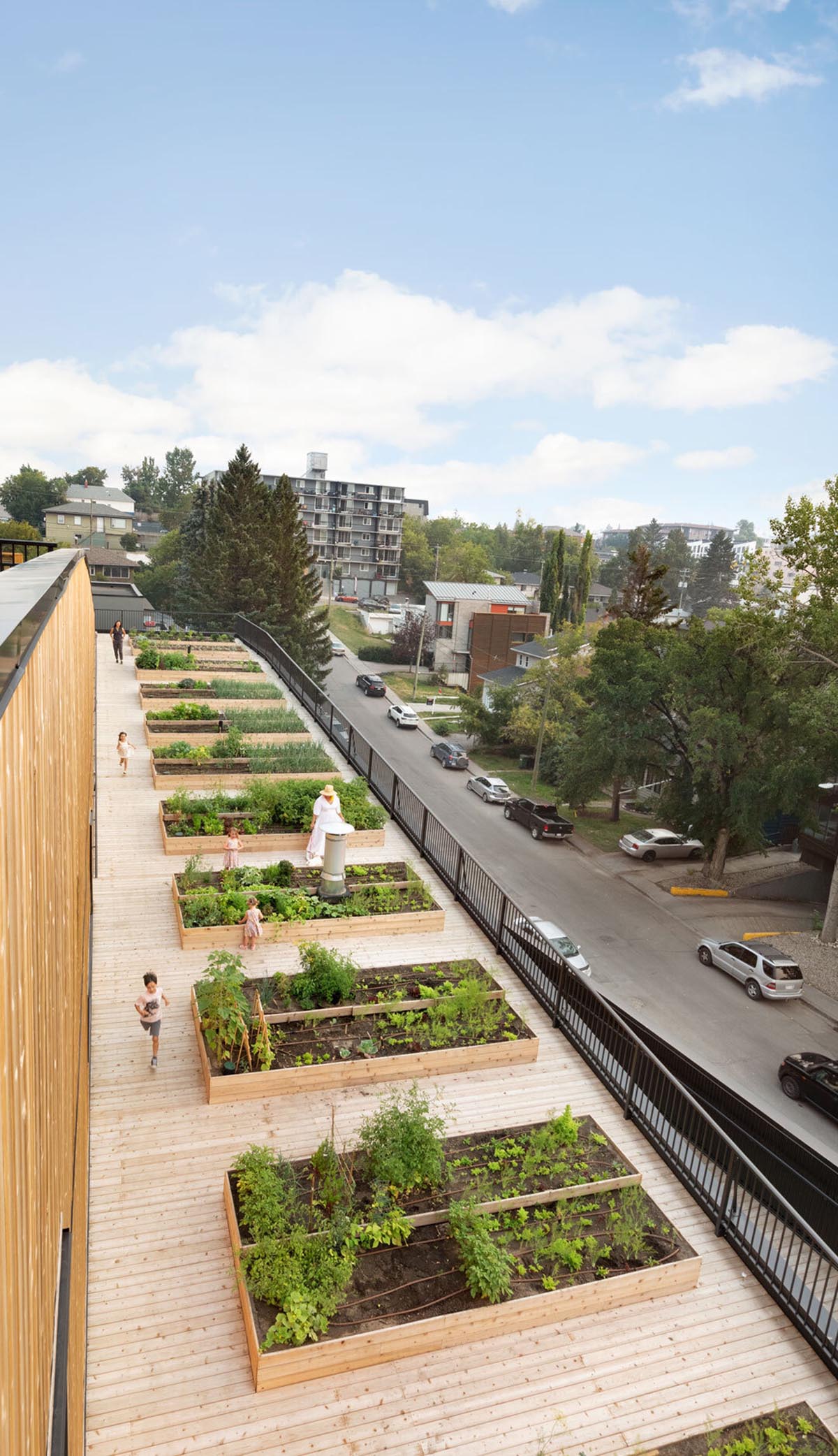 Multi-residential housing by MODA features a barrier-free rooftop urban farm in Calgary