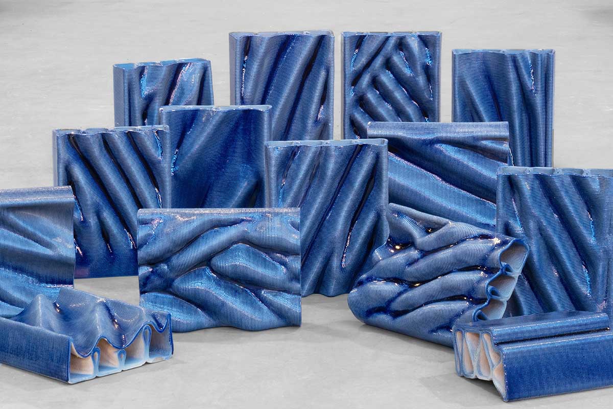 Studio RAP clads two gates of PoortMeesters residential building block in 3D blue porcelain