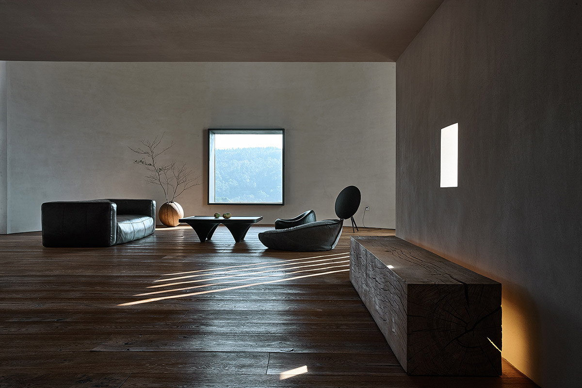 ZMY Design creates earth-toned interiors for a woodwork enthusiast’s house in Fujian, China