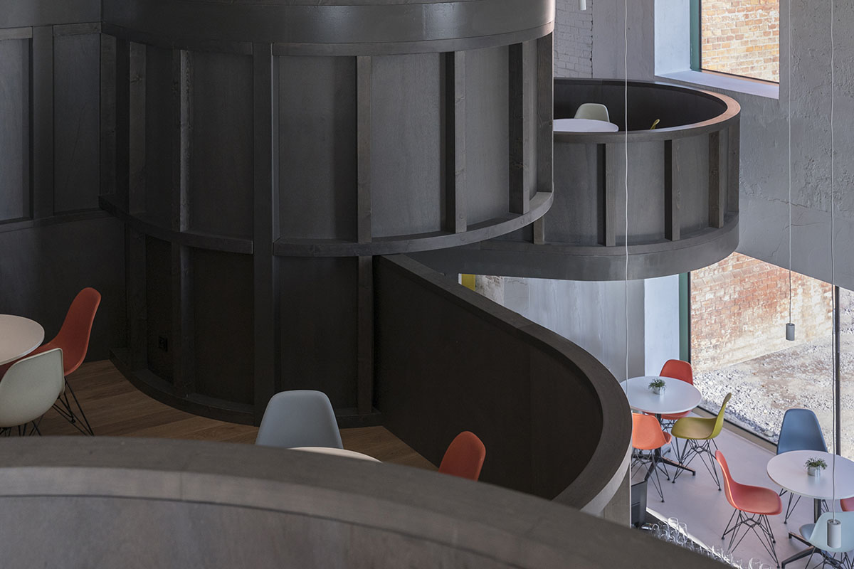 CHYBIK + KRISTOF converts historic brewery into House of Wine with rounded black volumes in Znojmo