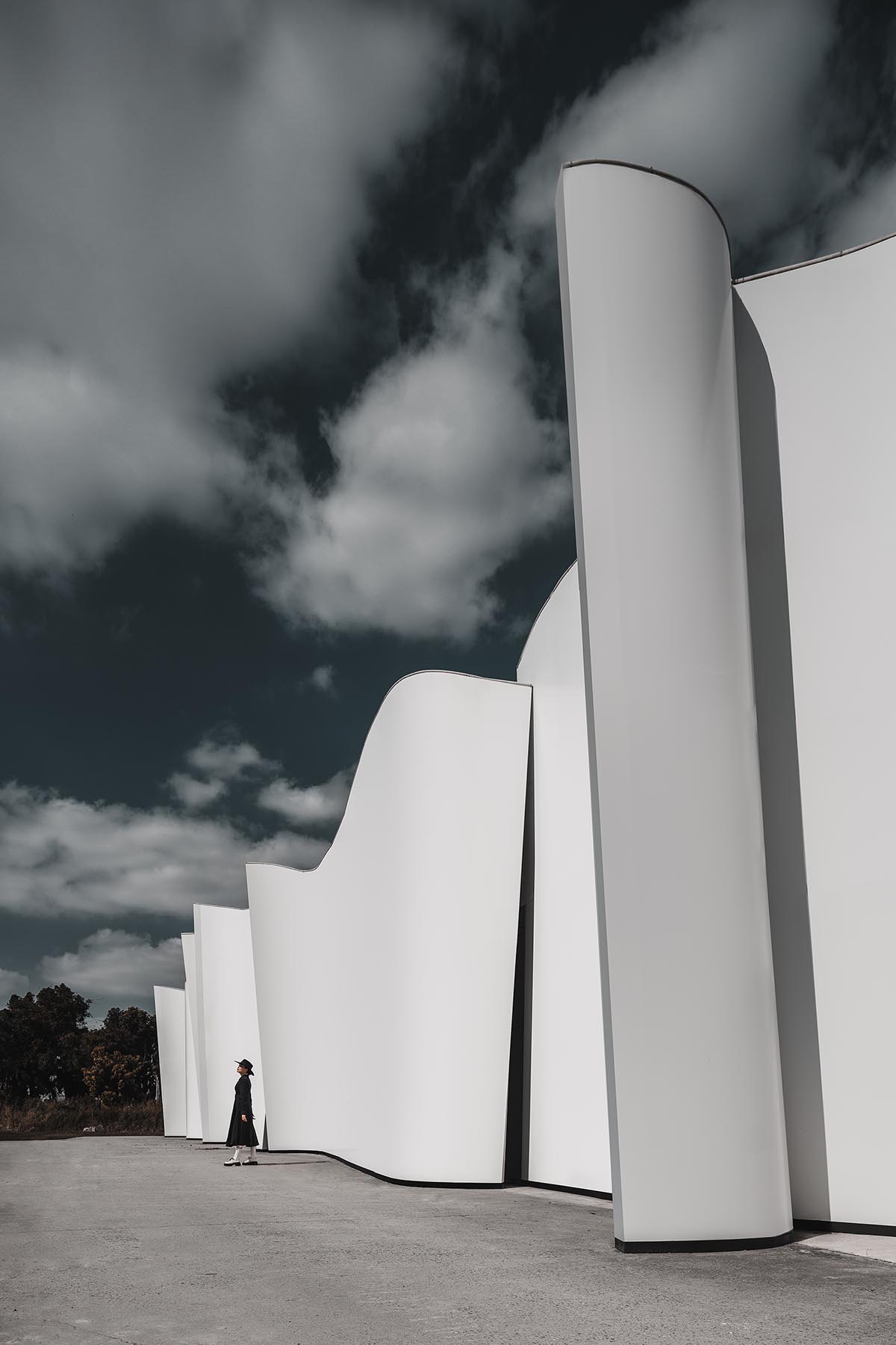 Chinese chapel creates a fluid silhouette featuring curving walls to mimic blossoming petals 