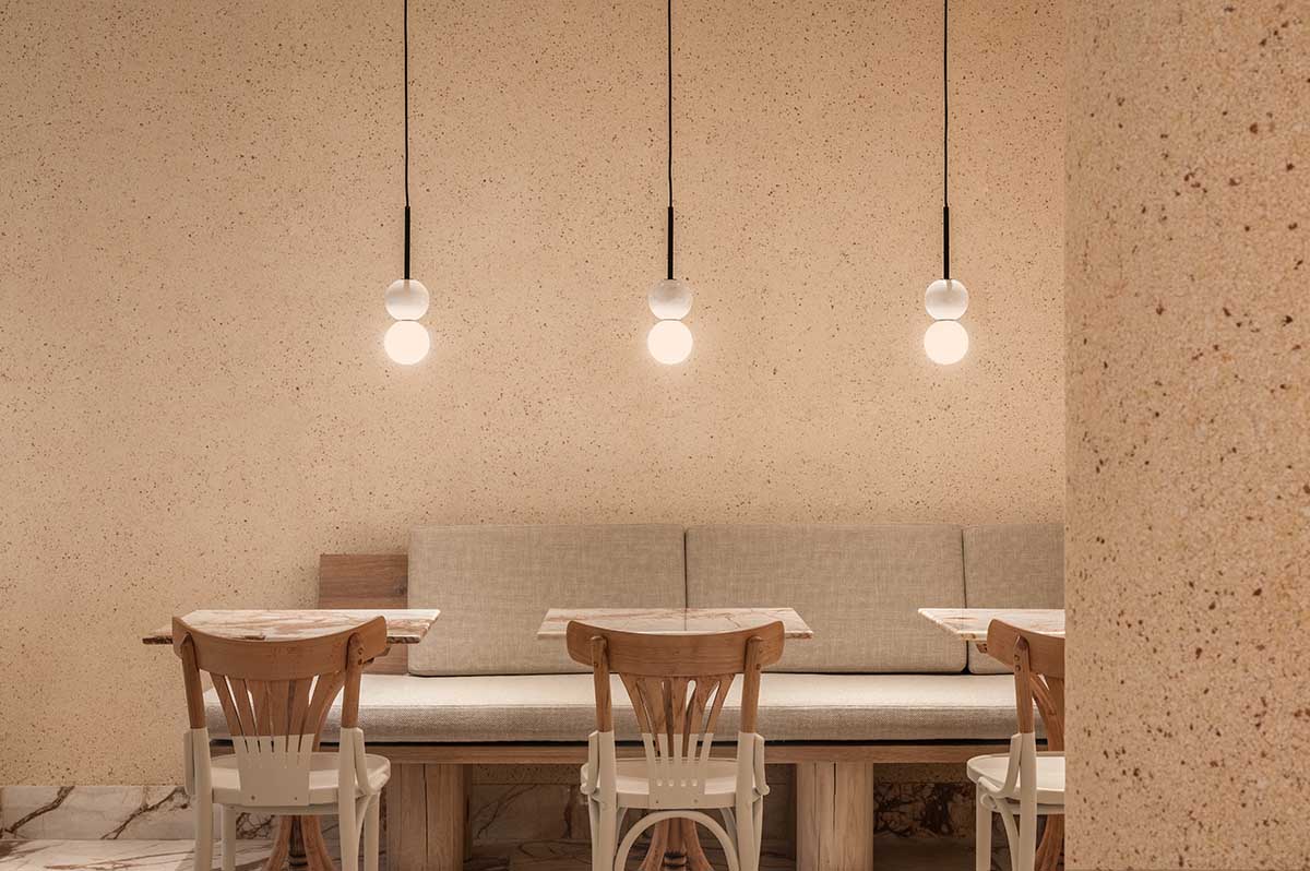 YOD Group clads the walls of a pastry shop in eggshell plaster in Lviv, Ukraine