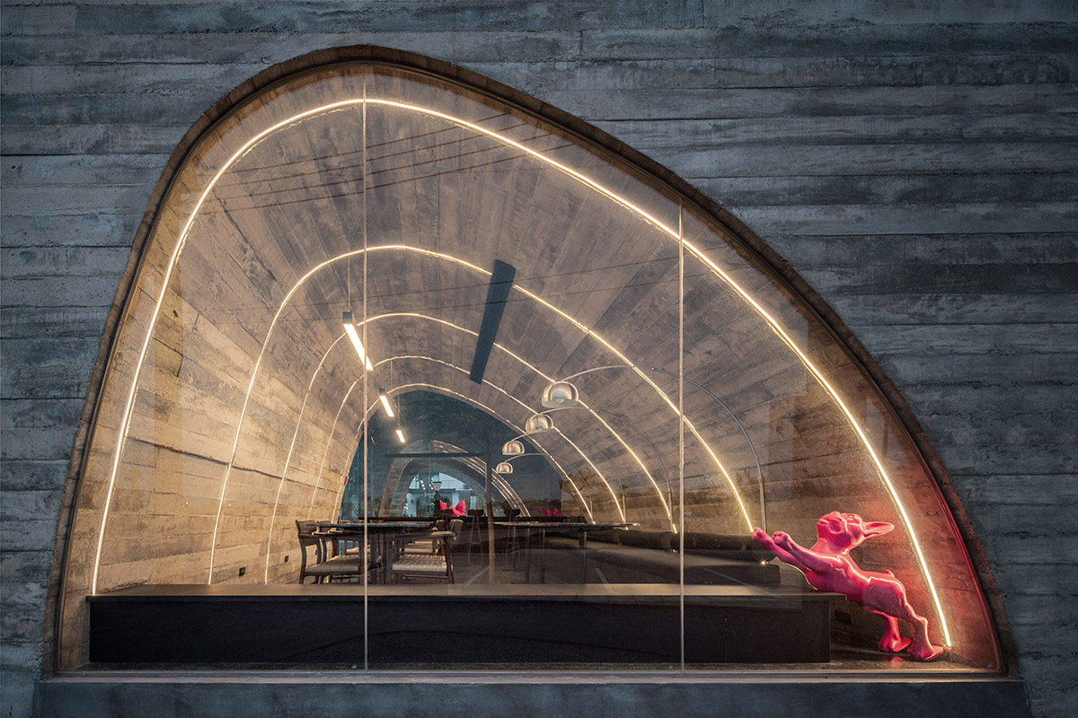 French Kitsch III is a cathedral-like cafe in Thailand that features imperfect arches