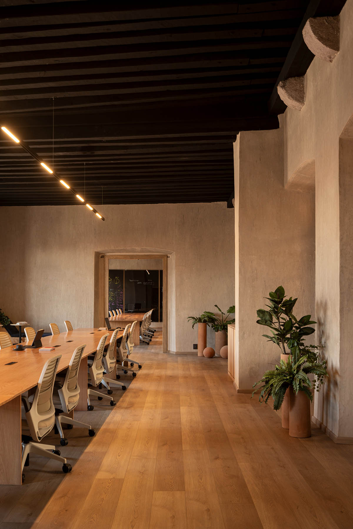 FMA. designs corporate building with warm, earthy tones in a former 17th-century convent