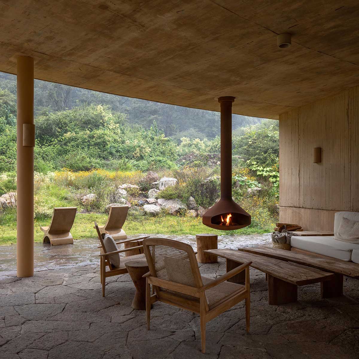Fernanda Canales creates a circular home framing a mountain and a volcano in Mexico