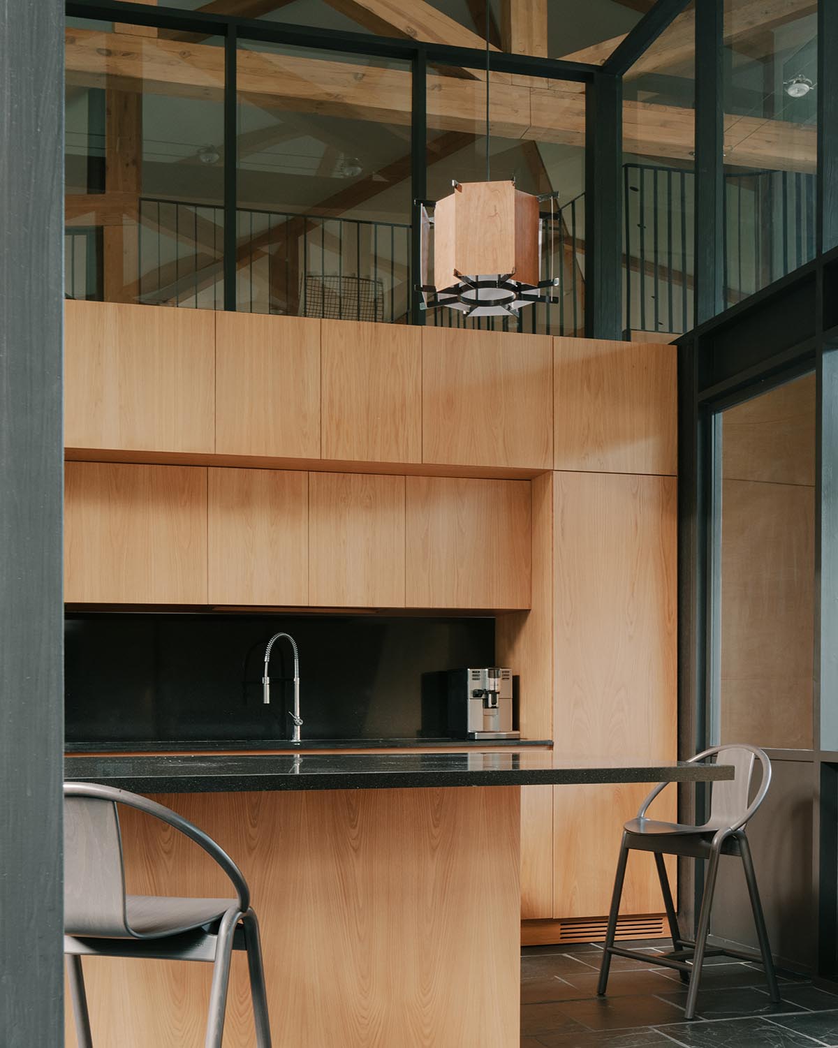 The stone and wood Tbilisi residence integrates architecture with the natural landscape