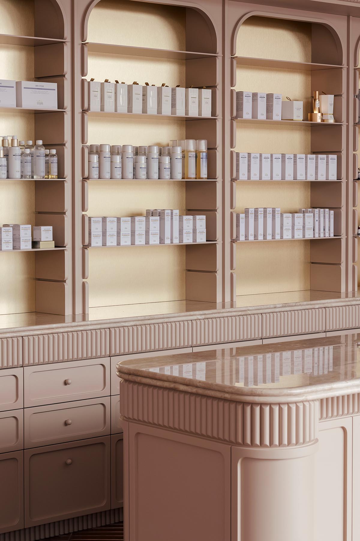 Odami enriches the interiors of a beauty shop with rounded, bevelled details, and pinkish hues