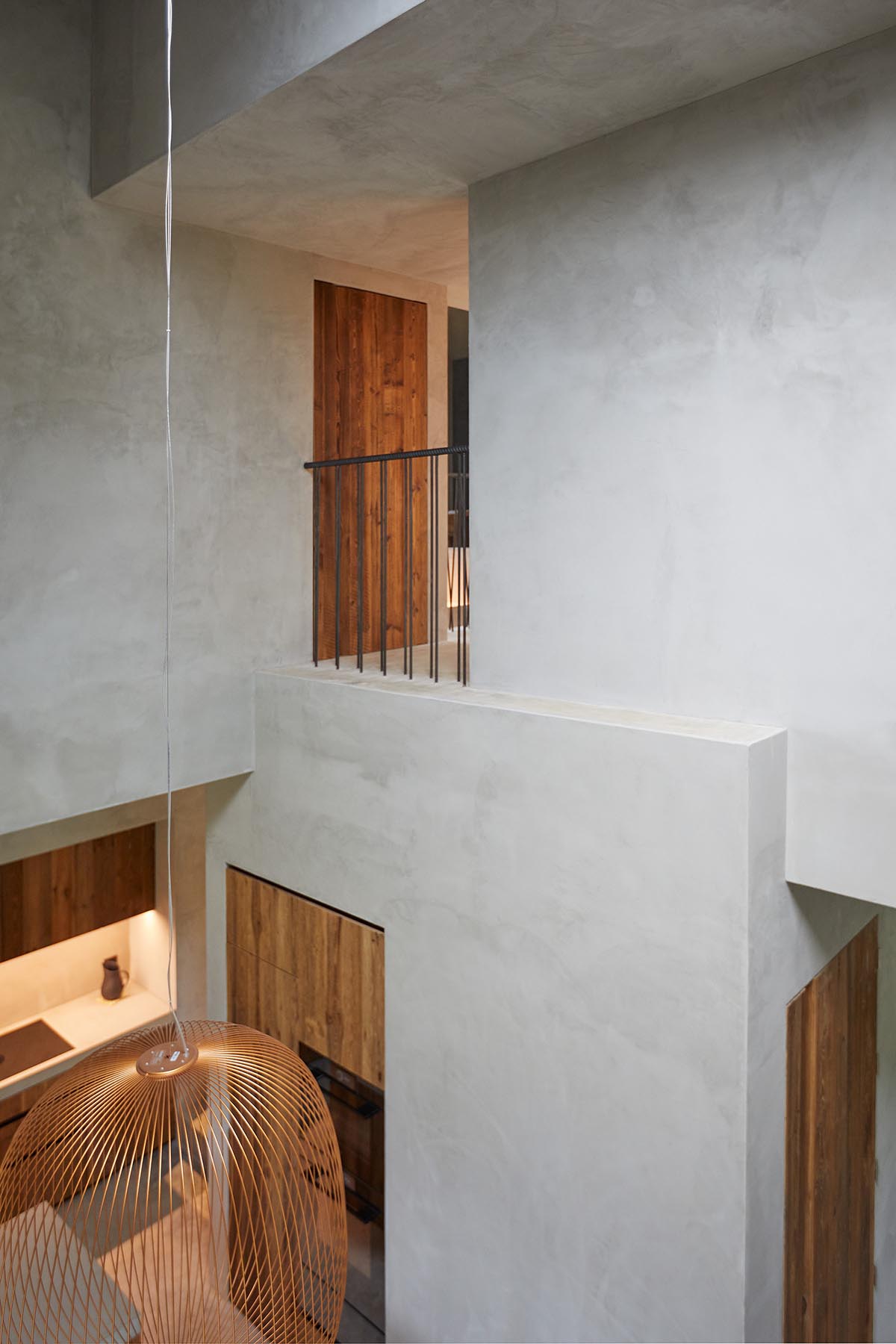 Residential barn features an unfinished, raw interior in Swiss rural landscape