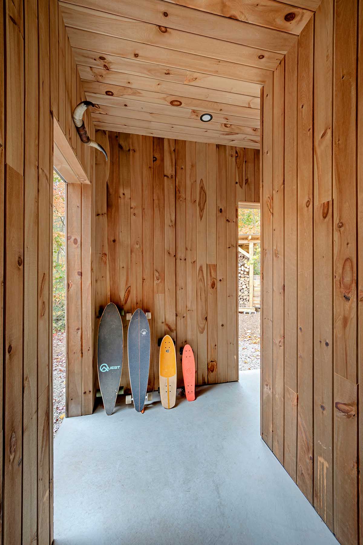 Country home is a wooden shelter that brings tranquility in the heart of the forest in Canada
