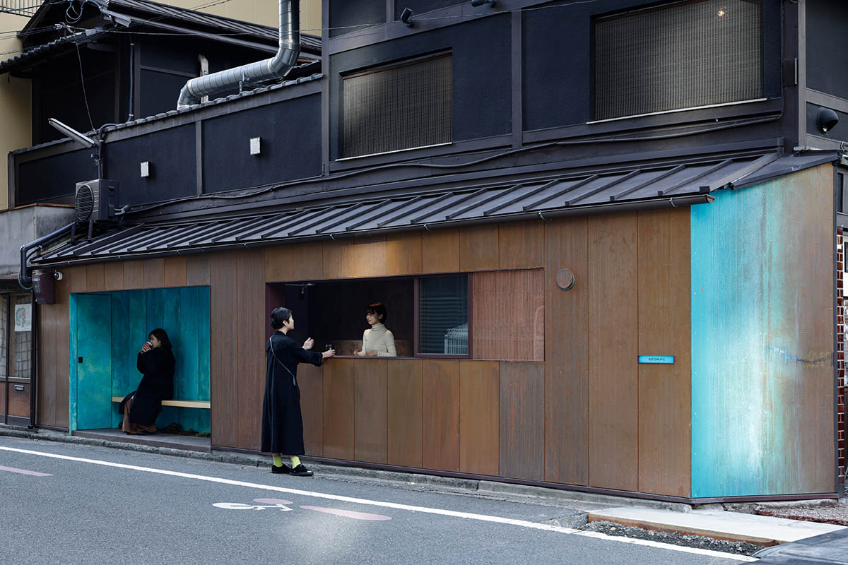 The one-meter-deep cafe invites customers with its patina color on its facade in Kyoto