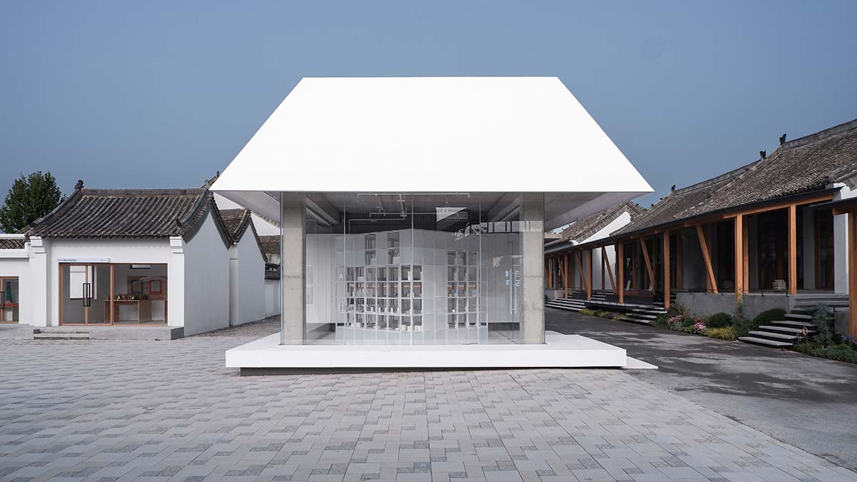 A shop is attached to Beijing historic Hutong houses with white-colored skin