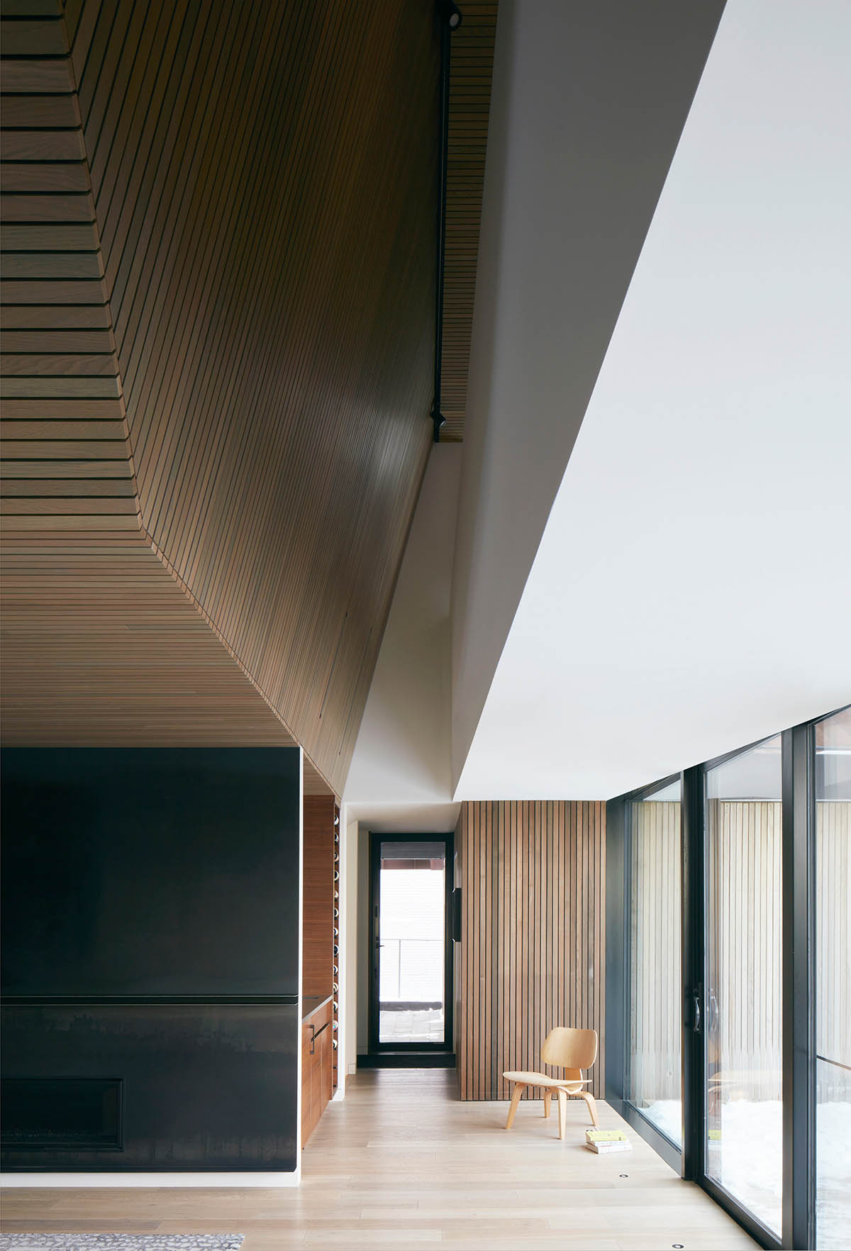 Weathered steel weil wraps the façade of Veil House in to resist snowfalls in Winnipeg