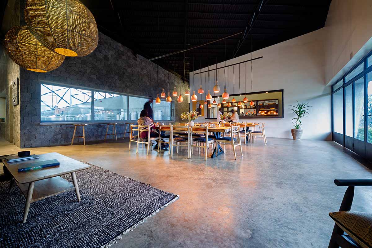 Striking geometric glass geometry resembles an open eye at a distillery in Rwanda