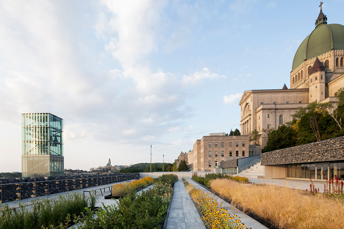 A striking bell tower pierces the sky, illuminating the grandeur of the pavilion in Montreal