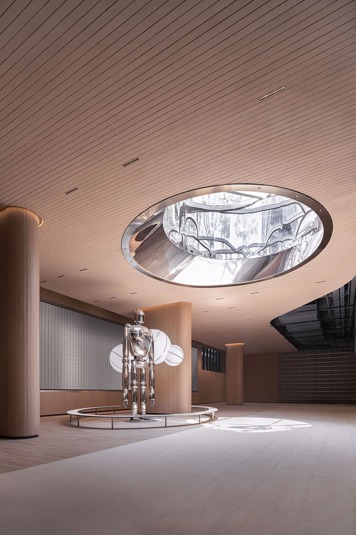 TOMO Design creates interiors for metro station with soft wood hues and circular light strip