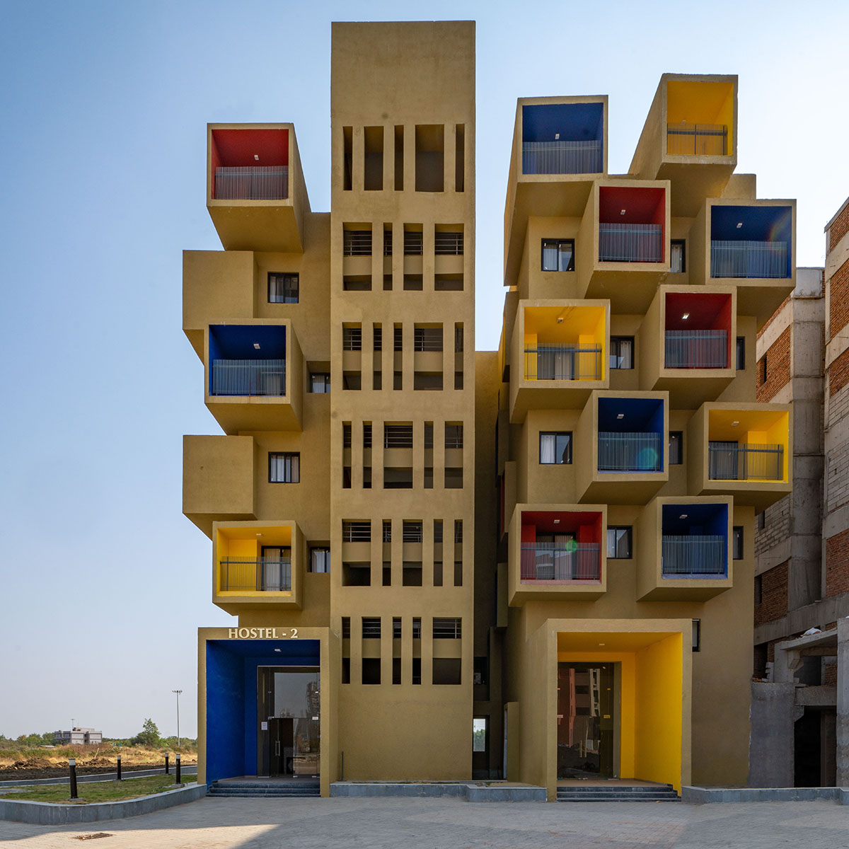 Sanjay Puri Architects designs residential building with colorful cuboid terraces in India