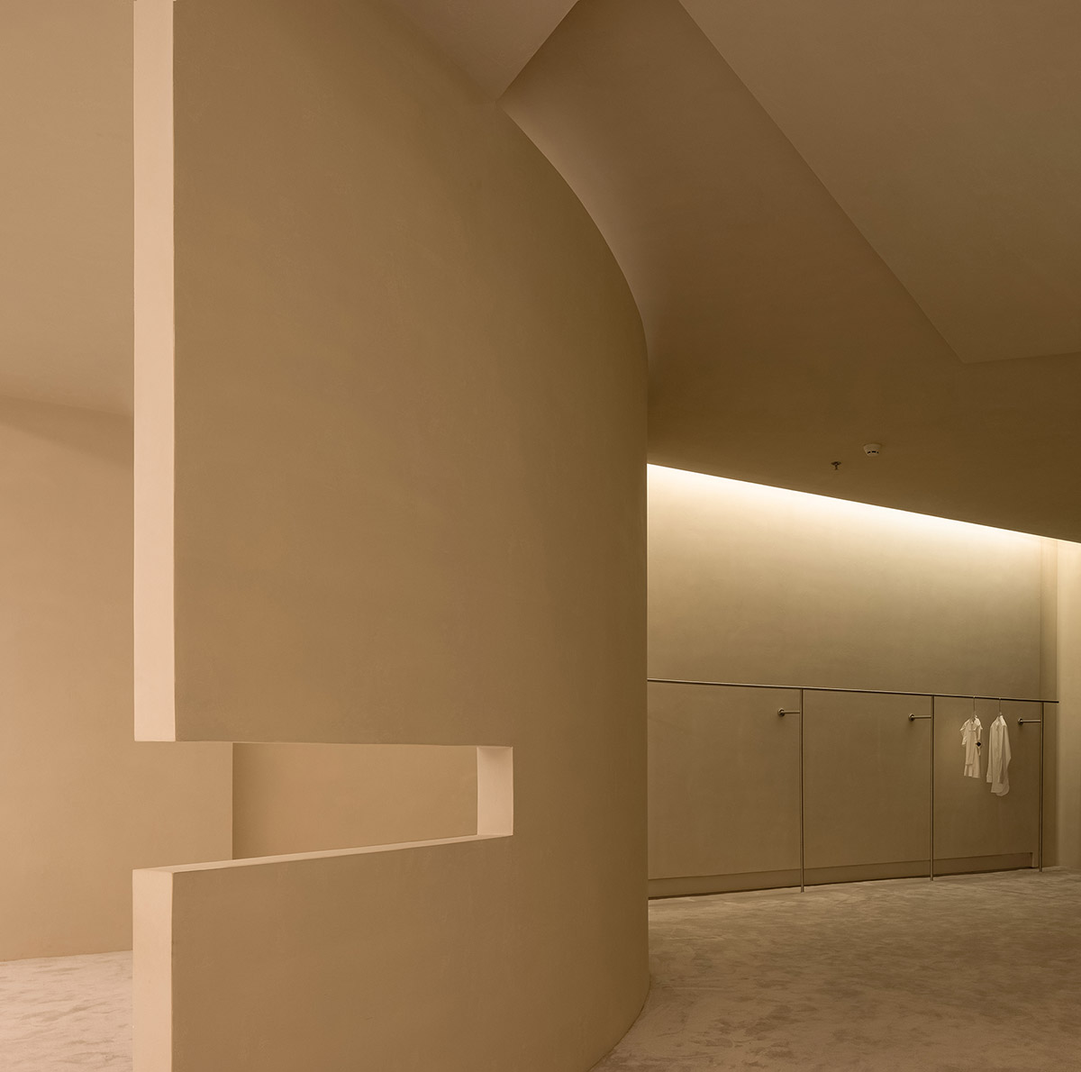 AD ARCHITECTURE designs store with light yellow curved walls that create comfort and softness 