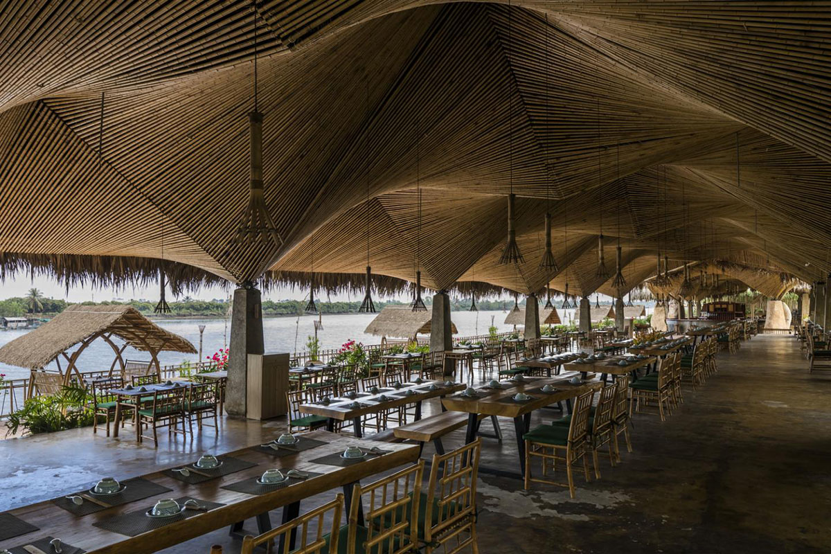 DDconcept Architecture uses coconut leaves and bamboo to create undulating restaurant in Vietnam